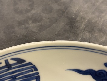 A Chinese blue and white 'dragon and Shou' dish, Yongzheng mark and of the period